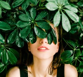 Woman In Black Top Beside Green Leafed Plant 1078058